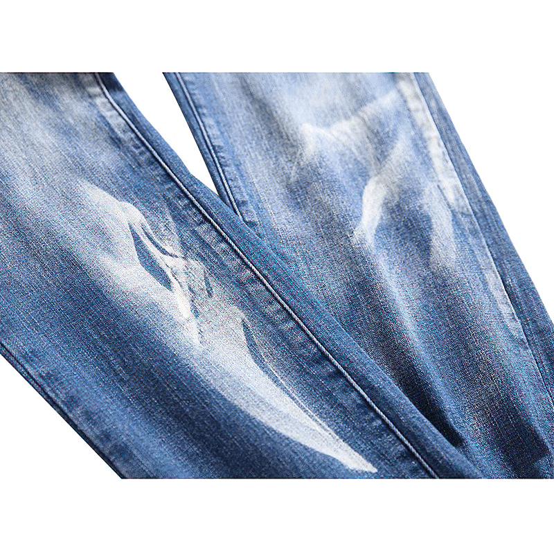 Men's blue denim jeans featuring stylish faded design and subtle ghost print. Perfect for trendy streetwear looks.