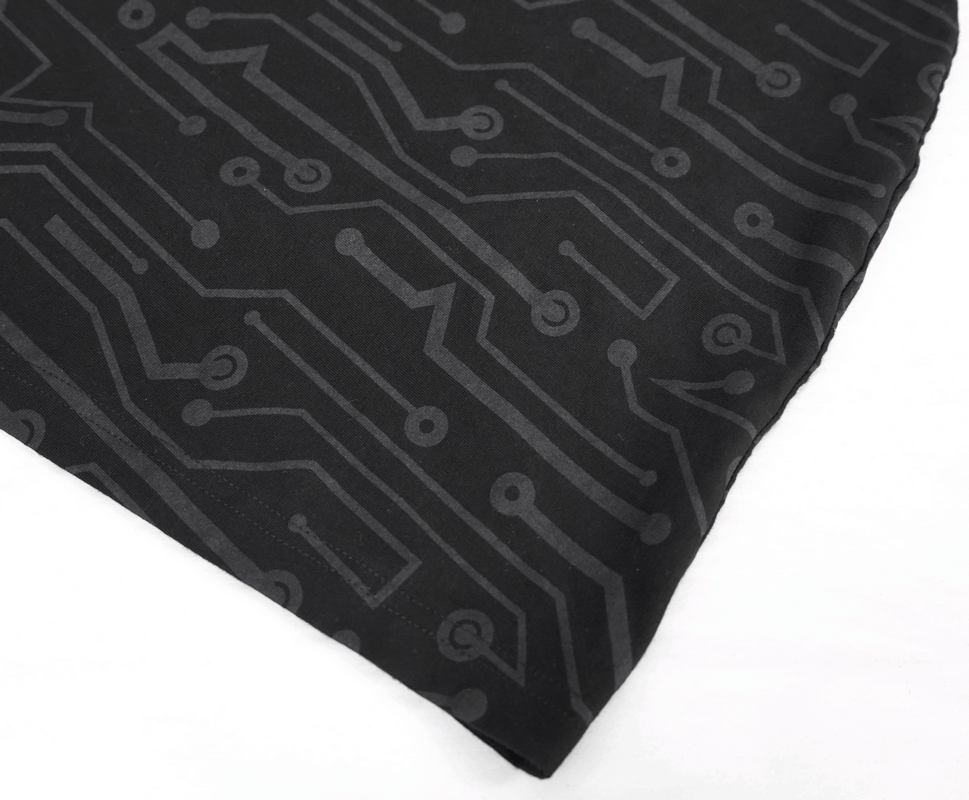 Close-up of black fabric featuring a circuit board pattern, perfect for steampunk and cyberpunk styles.