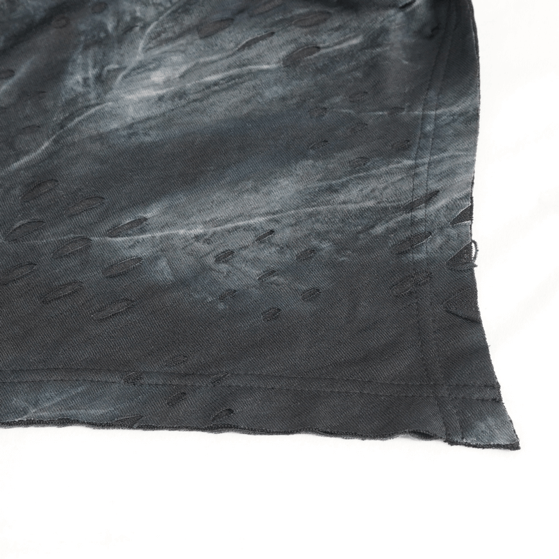 Close-up of the textured hem of the Rogue Edge asymmetrical men's top featuring unique patterns.