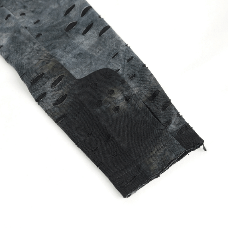 Close-up of men's asymmetrical textured top featuring edgy cutouts and a high neck design.