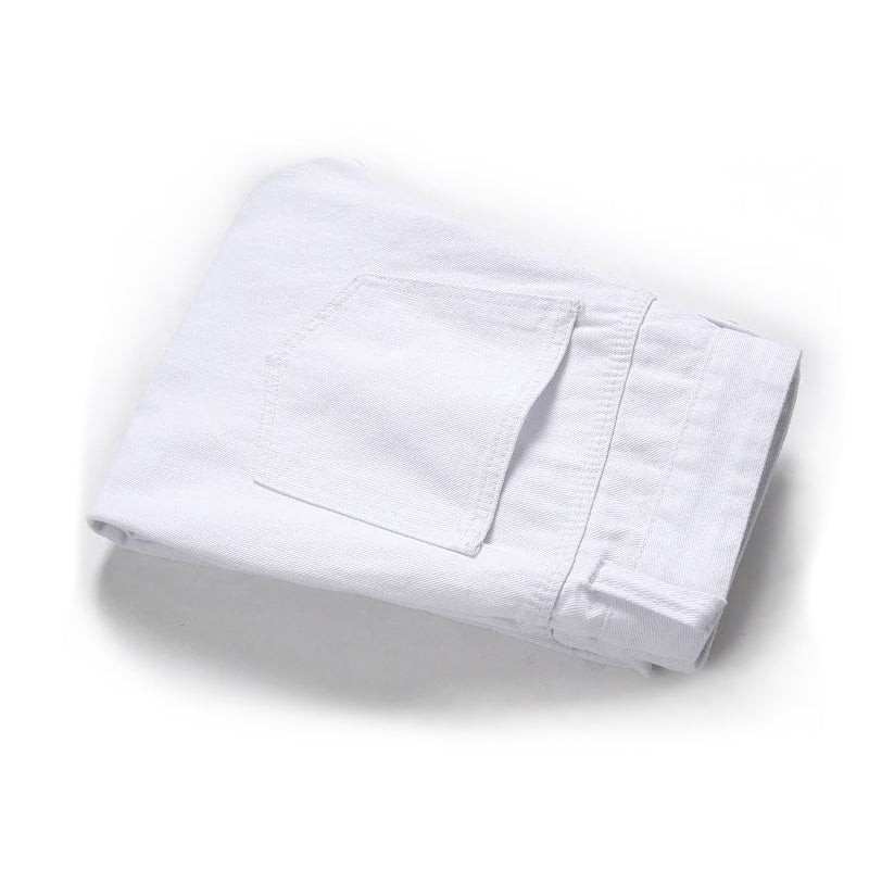 Folded white men's biker jeans with back pocket detail, showcasing stylish denim for a trendy look.