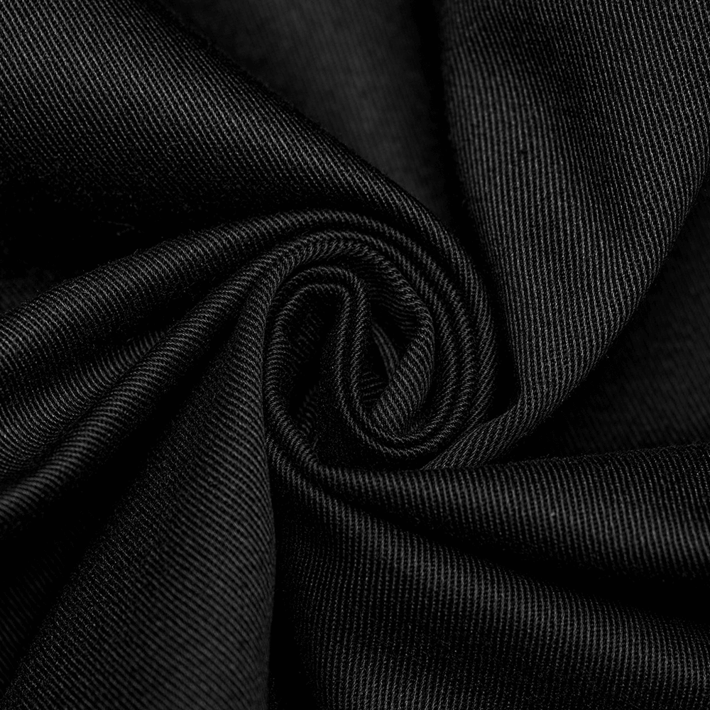 Close-up of black twill fabric, showcasing its smooth texture and durability for fashion garments.