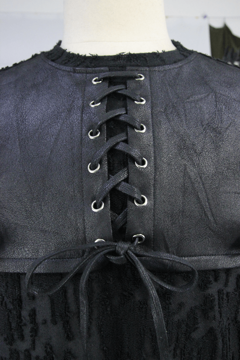 Close-up of a men's gothic black top featuring a unique leather lace-up back design and trendy fabric texture.