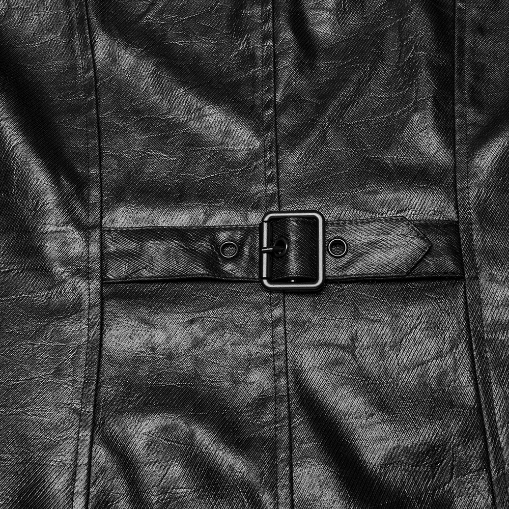Close-up of a black faux leather coat featuring a stylish buckle detail.