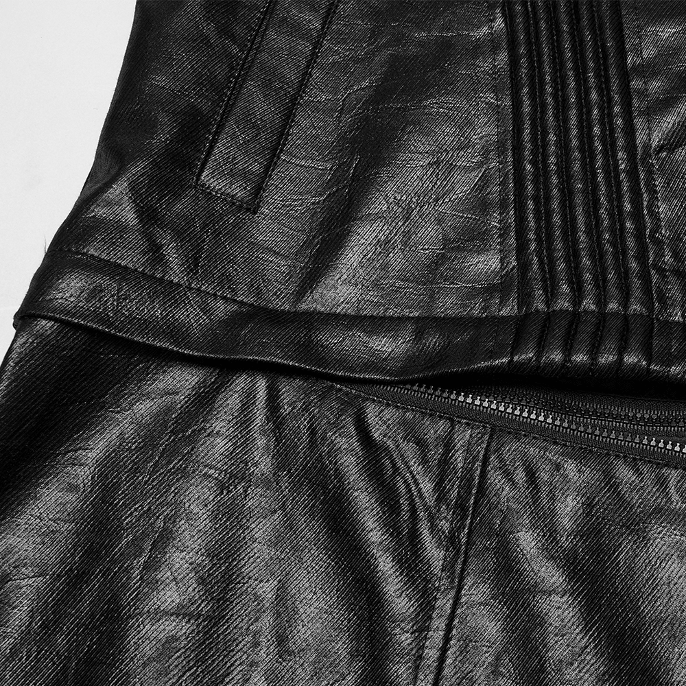 Close-up of a black faux leather jacket showing details of the fabric and stitching.