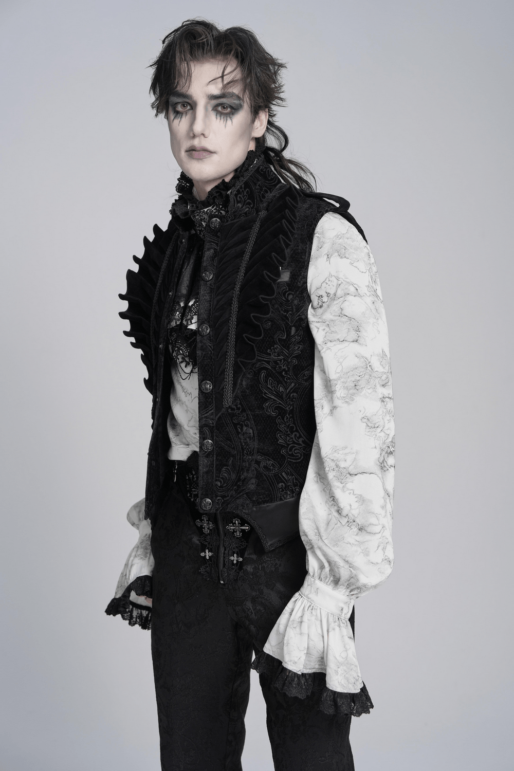 Men's Black Gothic Velvet Waistcoat with Buckles styled with dramatic makeup and ruffled shirt, showcasing Victorian elegance.
