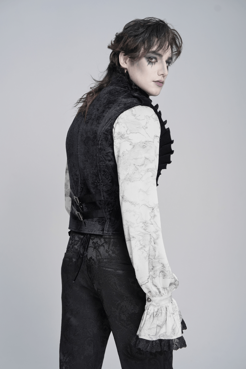 Men's Black Gothic Velvet Waistcoat with Buckles worn over a stylish ruffled shirt, showcasing Victorian elegance.