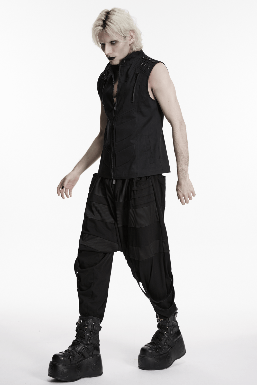 Men's Black Industrial Punk Vest with Rivet Detail worn with stylish black cargo pants and chunky boots.