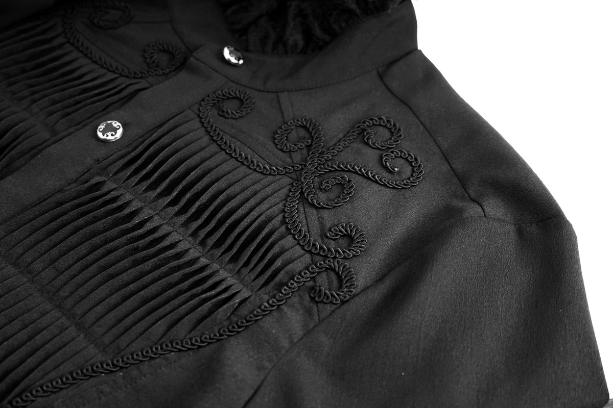 Close-up of a men's black gothic shirt with lace details and pleats, showcasing elegant vintage style.