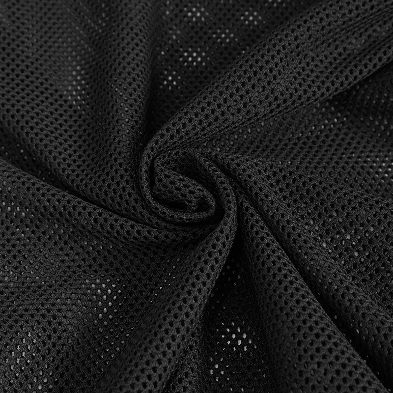 Close-up of black sheer hexagonal diamond mesh fabric, ideal for gothic style clothing.