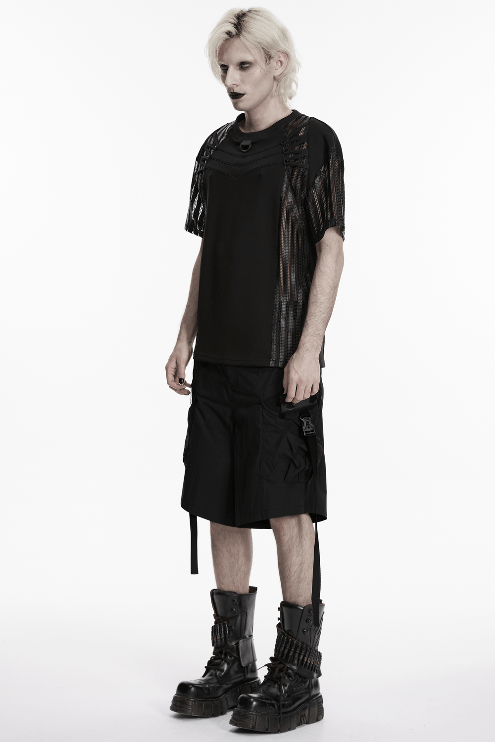 Men's Black Mesh Sleeved Tactical Gothic T-Shirt modeled by a man with a gothic style, featuring unique mesh sleeves and cargo shorts.