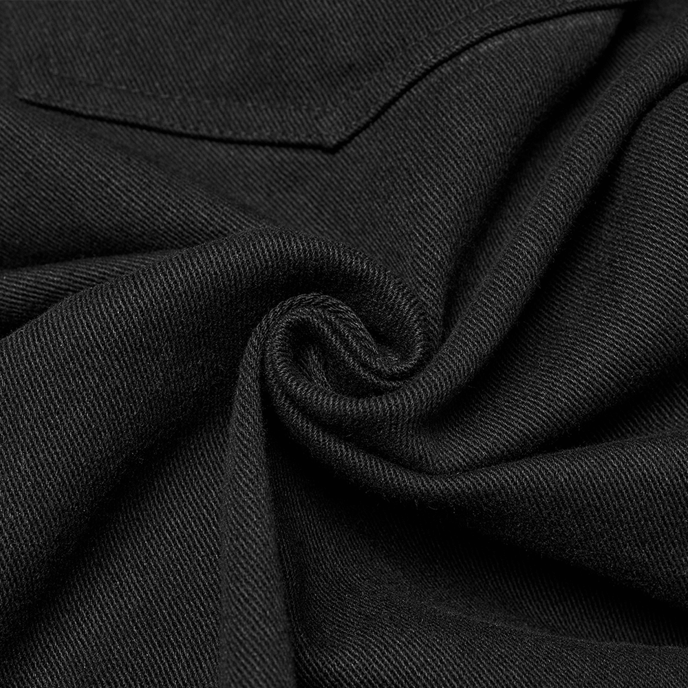 Close-up of micro elastic twill fabric in deep black, showcasing texture and softness for punk-style pants.