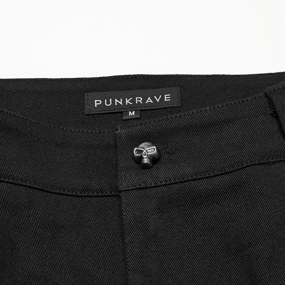 Close-up of Punk Rave men's black pants featuring a skull rivet and brand tag, perfect for punk fashion.