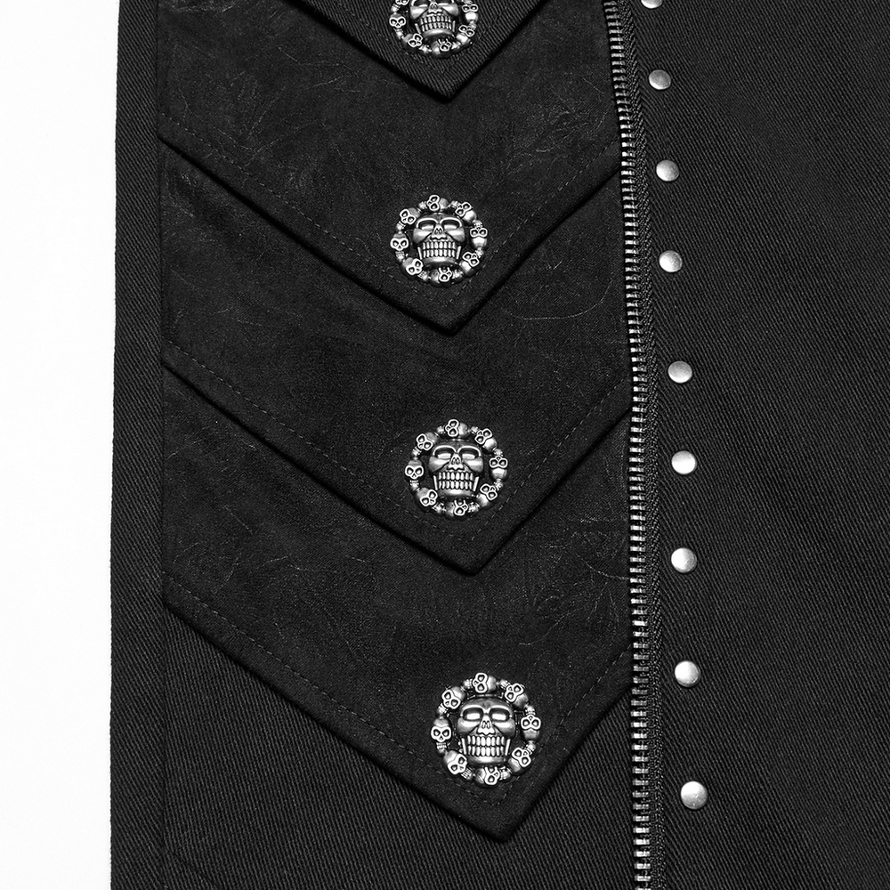 Close-up of gothic black pants featuring skull rivets and decorative zippers, perfect for punk fashion.