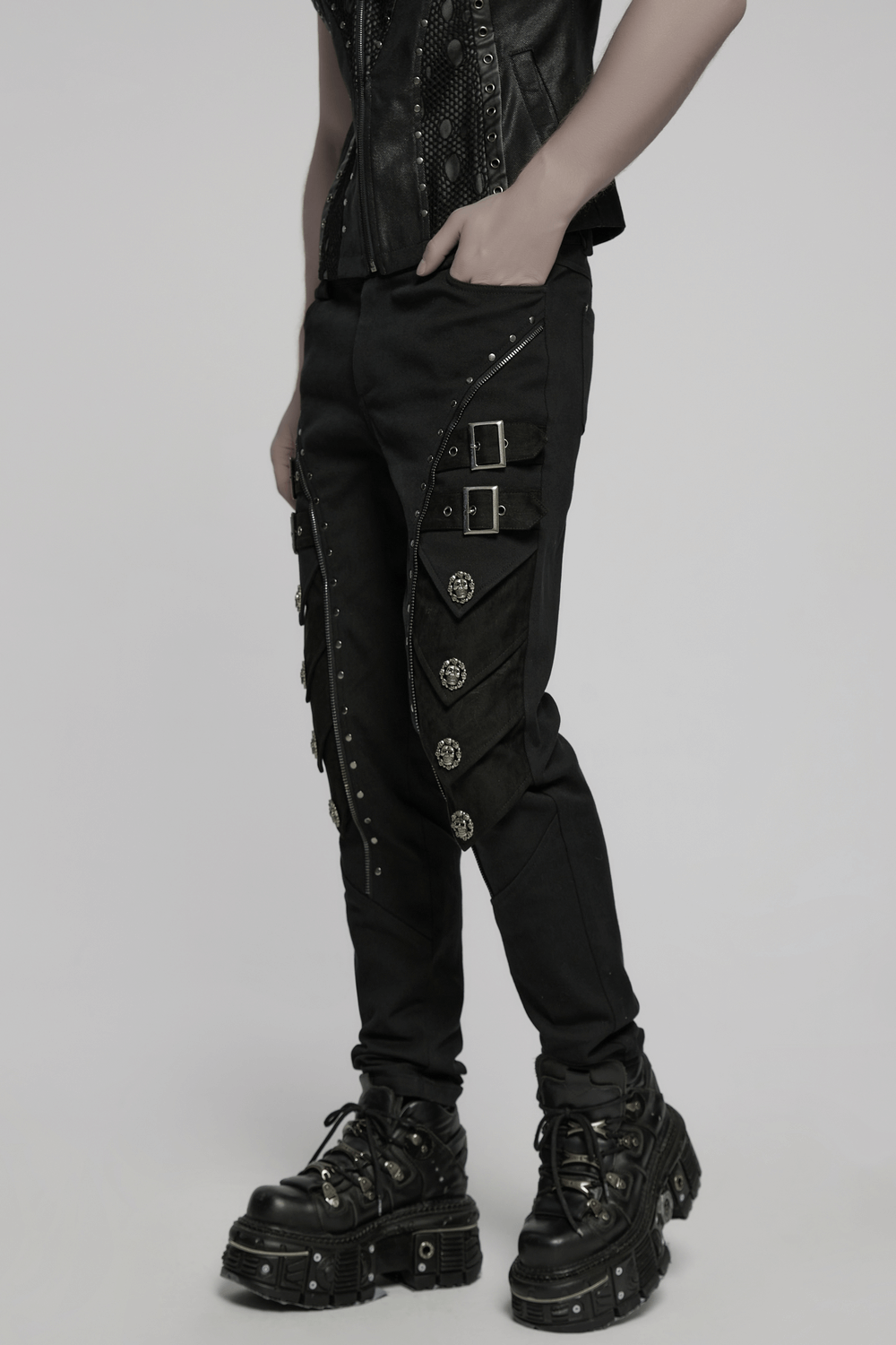 Men's black punk pants with skull rivets, buckle straps, and 3D armor details for dark fashion.