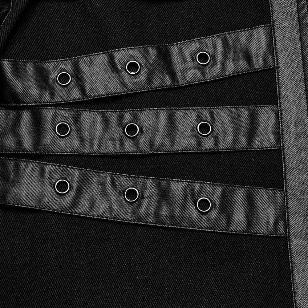 Close-up of black punk jacket showing eyelet loop straps and metal buckles for edgy style.