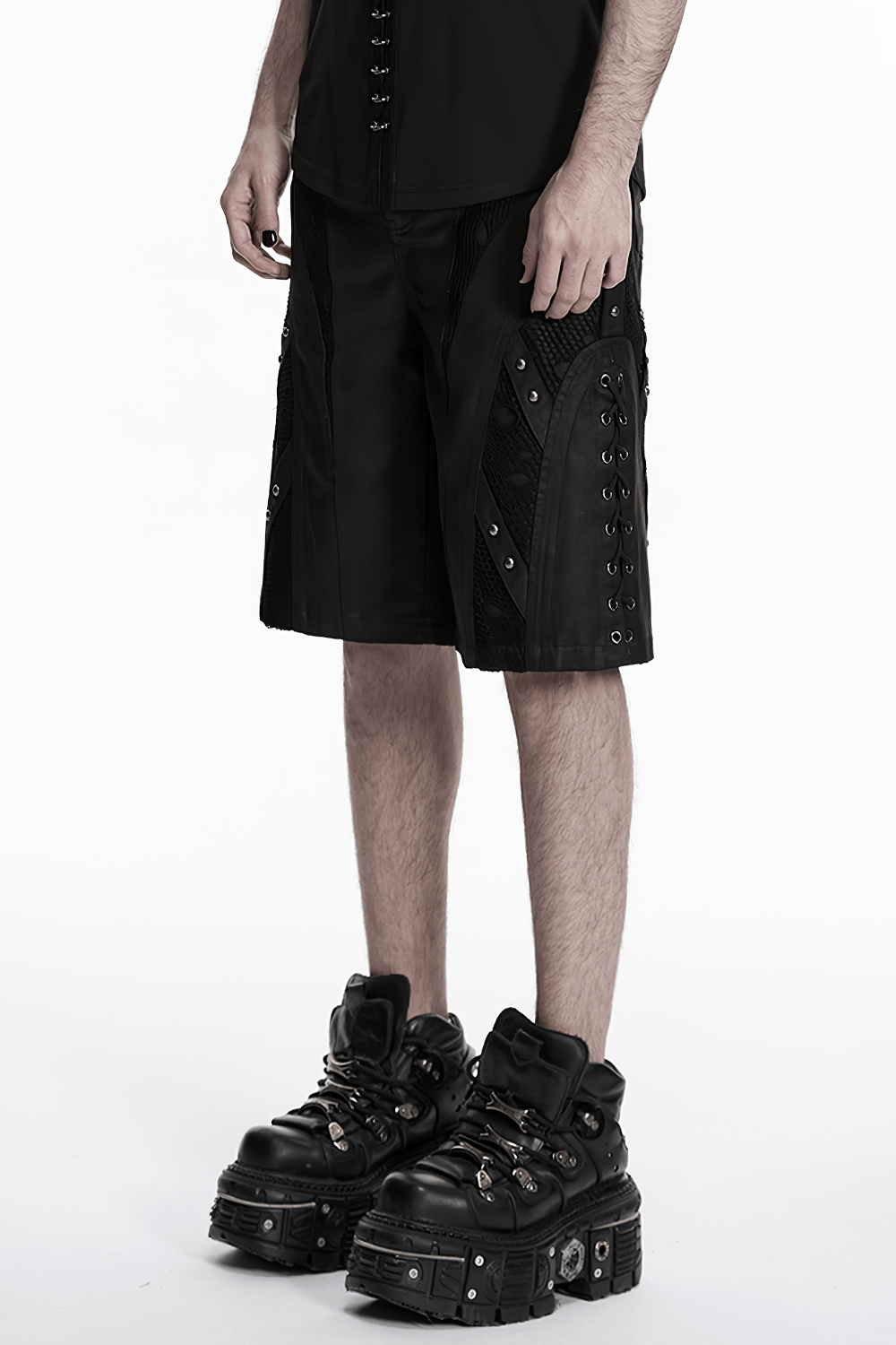 Men's Black Punk Mesh Panel Shorts with Studs worn with stylish platform boots.