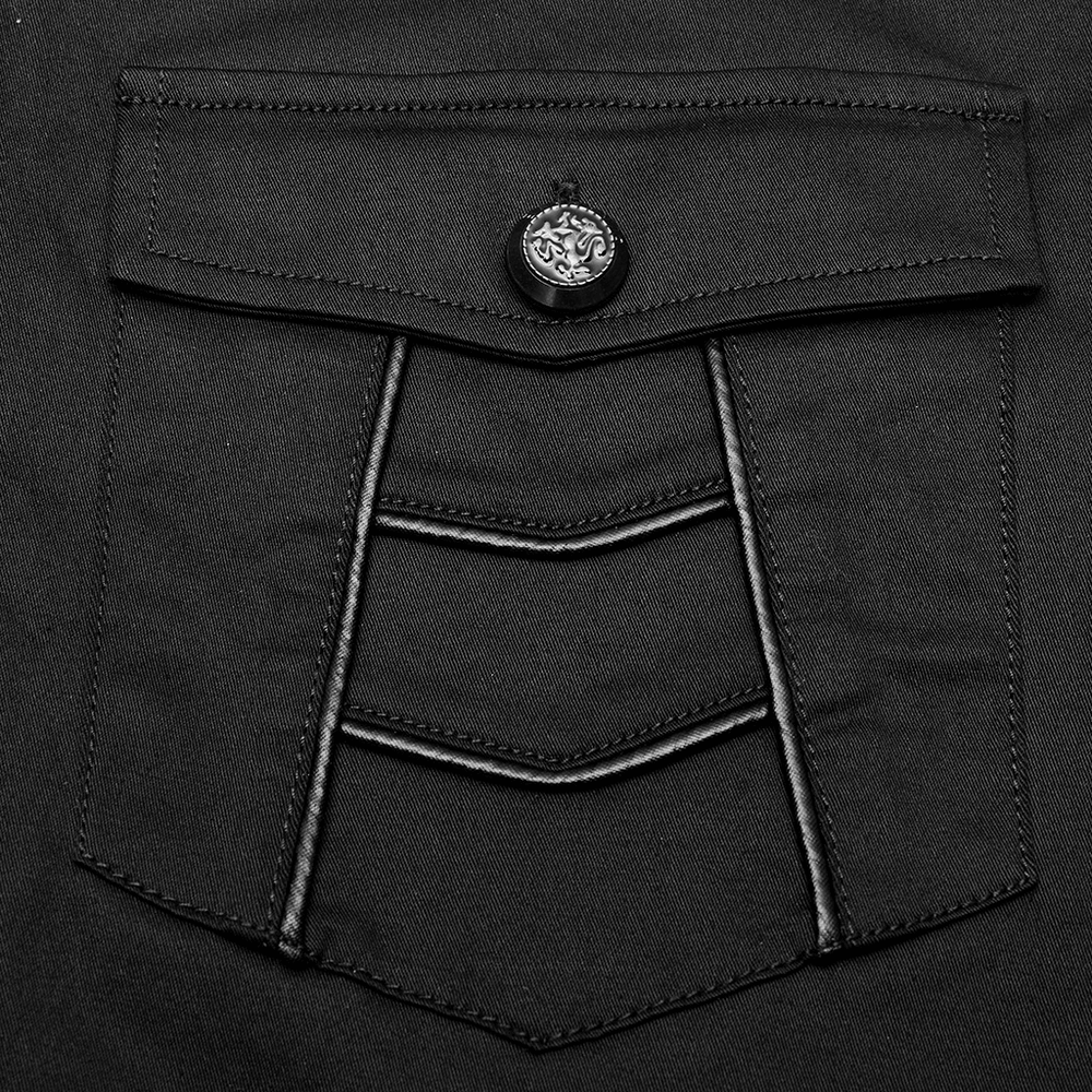 Close-up of a black short-sleeved punk shirt pocket with metal button and textured detail, showcasing edgy design elements.