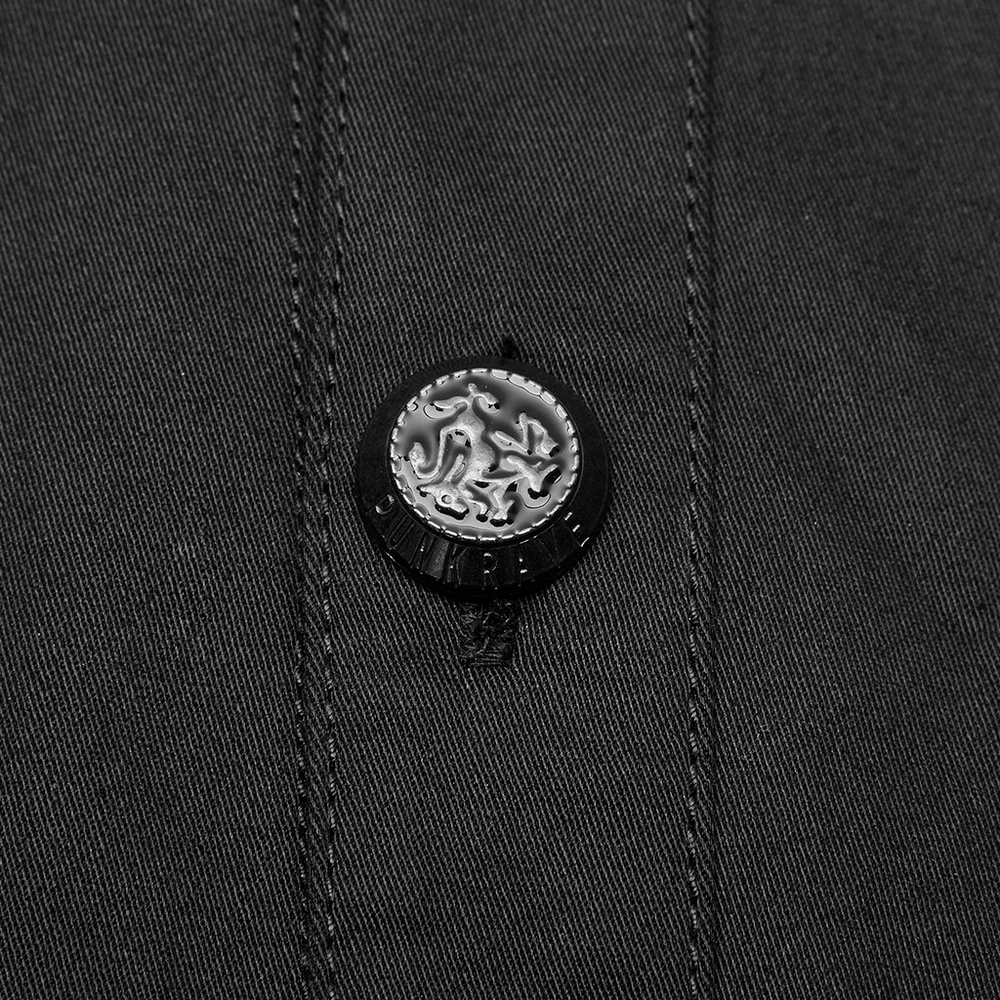 Close-up of a black metal button on a men's gothic short-sleeved punk shirt, showcasing unique design details.