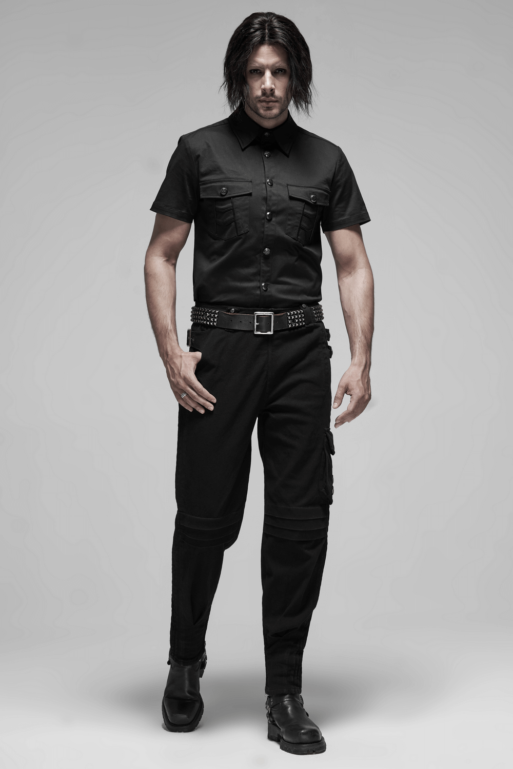 Men's black short-sleeved punk shirt with metal buttons and pockets, styled for an edgy gothic look.