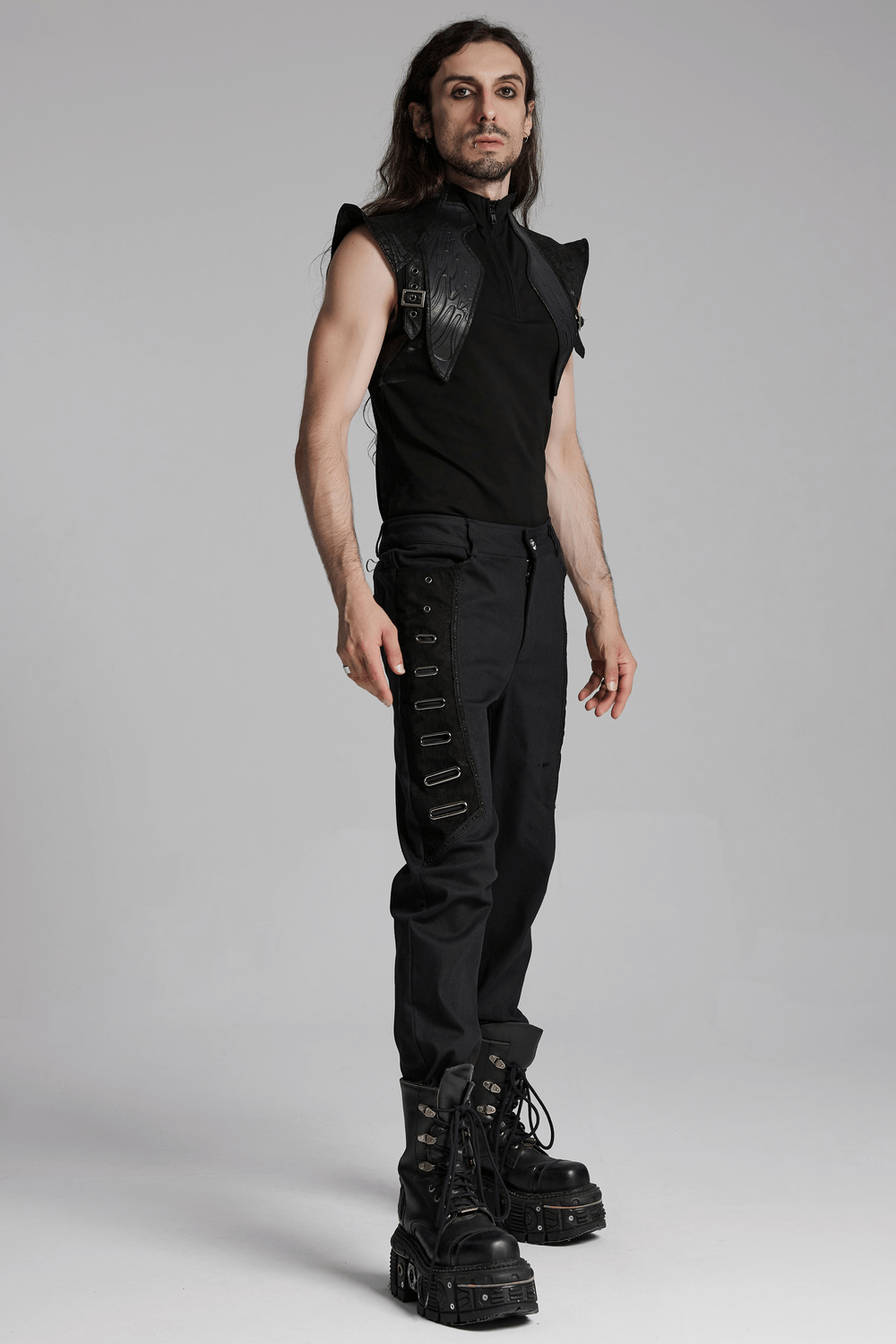 Men's cyberpunk sleeveless top with leather armor detail, paired with edgy pants and bold boots. Perfect for a futuristic look.