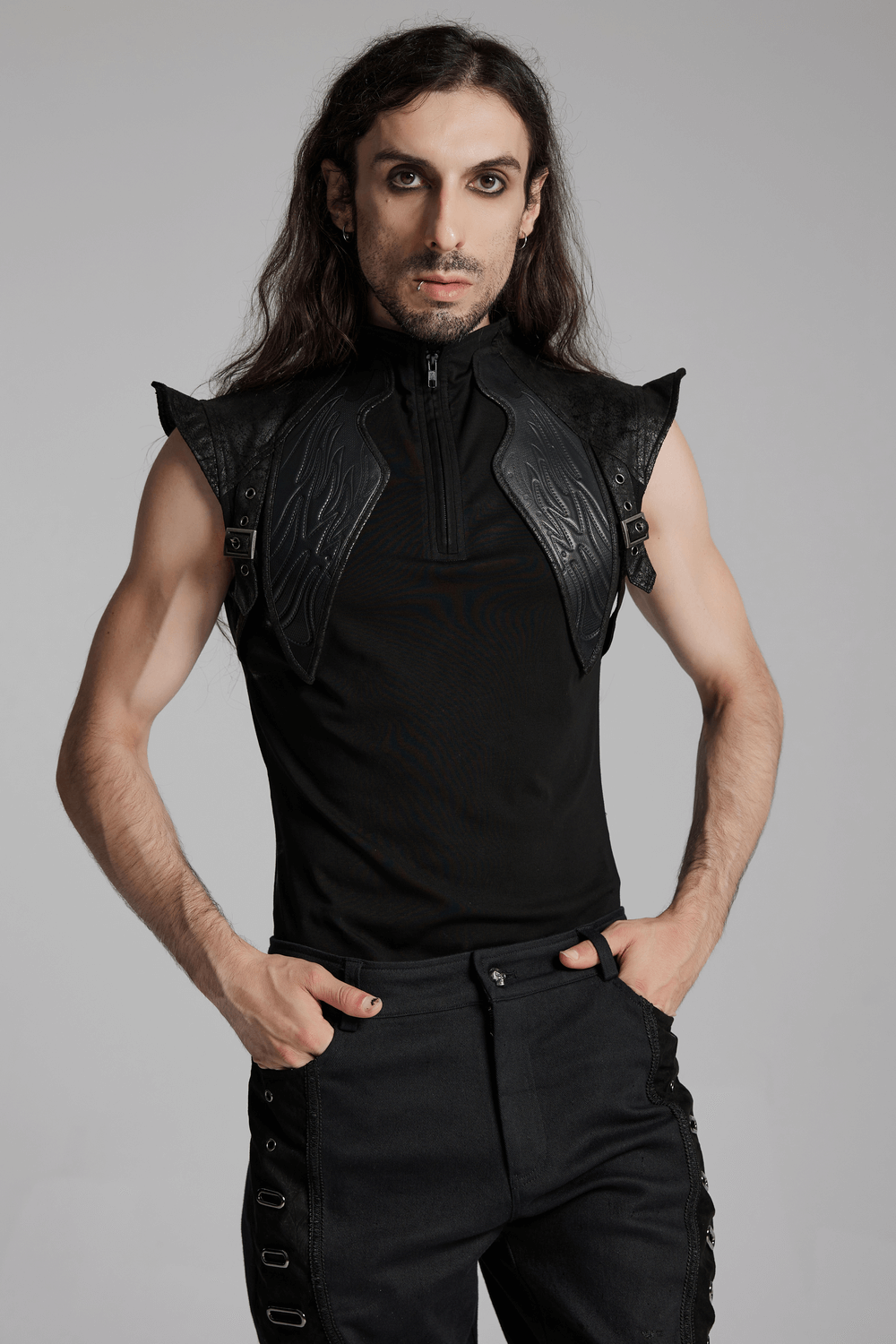 Men's sleeveless cyberpunk top with leather armor detail and stand collar, showcasing a bold, edgy style.