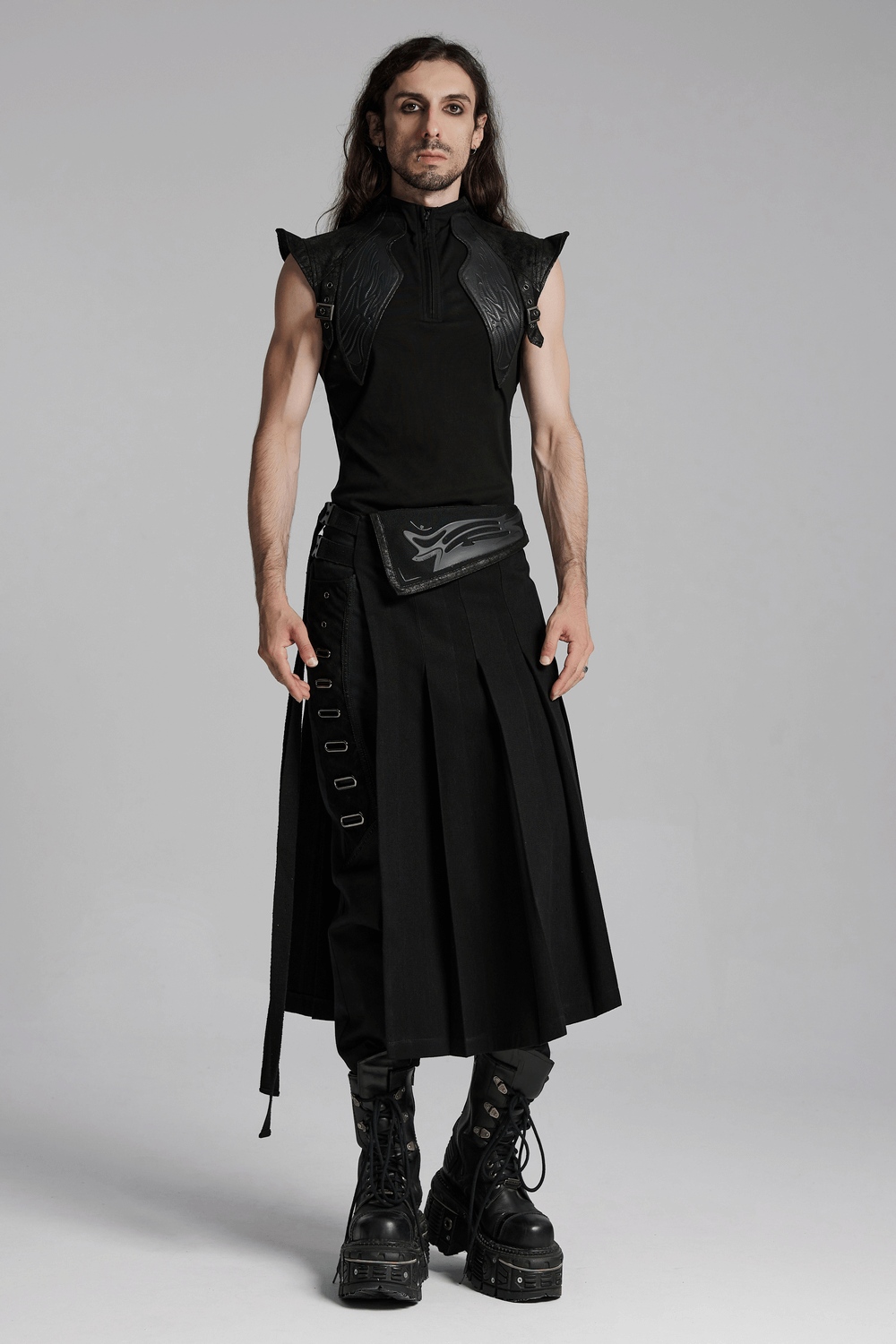 Men's cyberpunk sleeveless top with leather armor detail, paired with a stylish long black skirt and chunky boots.