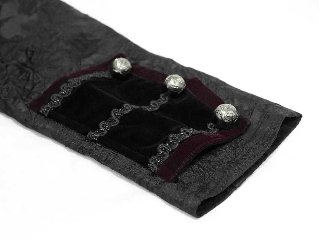 Close-up of men's gothic jacket sleeve featuring elegant brocade and silver buttons.