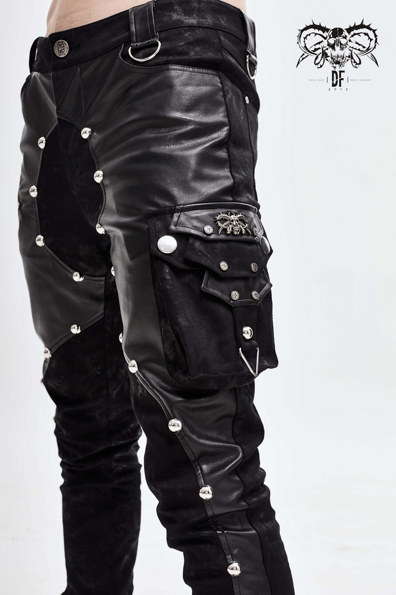 Men's punk style black trousers with asymmetrical rivets and faux leather detailing.