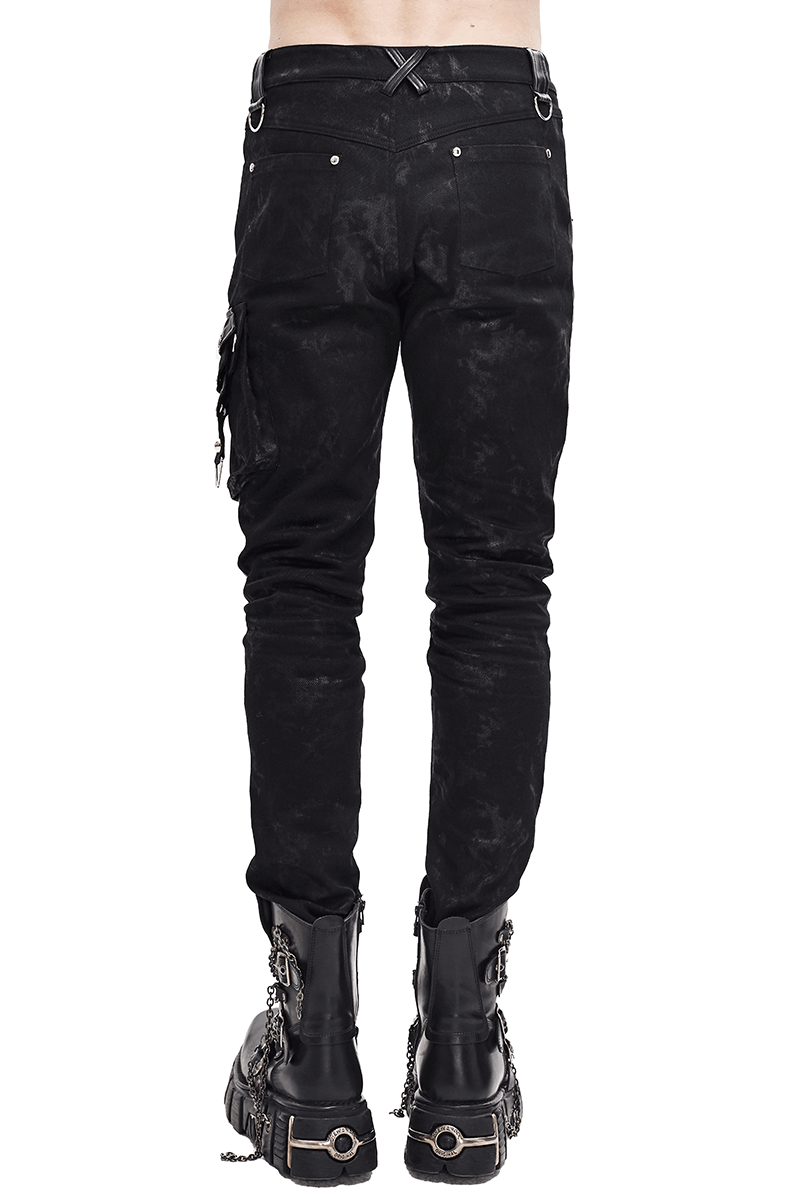 Men's black punk style trousers with asymmetric rivets and pockets, featuring a sleek back view.