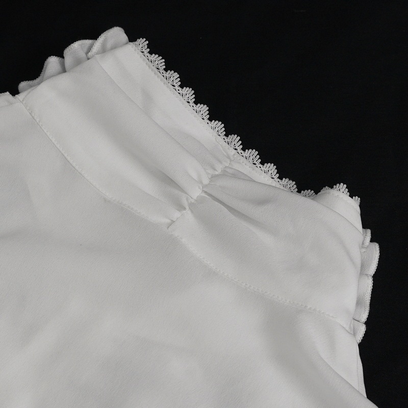 Close-up of a men's frilly white shirt featuring delicate ruffled cuffs and elegant detailing.