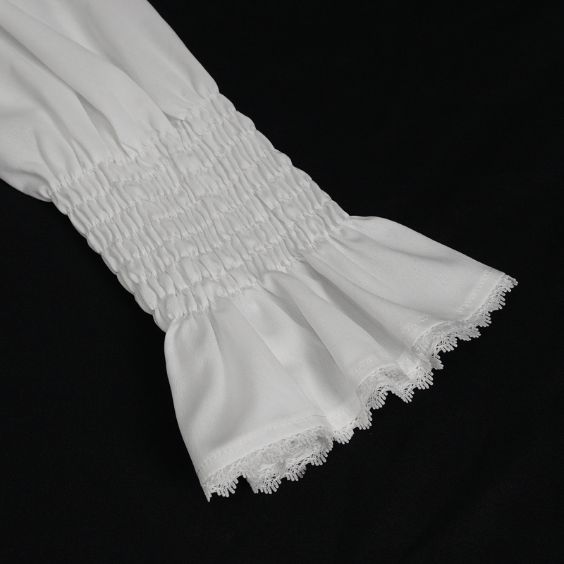 Close-up of a men's frilly white shirt's ruffled cuff highlighting vintage elegance and detailed craftsmanship.