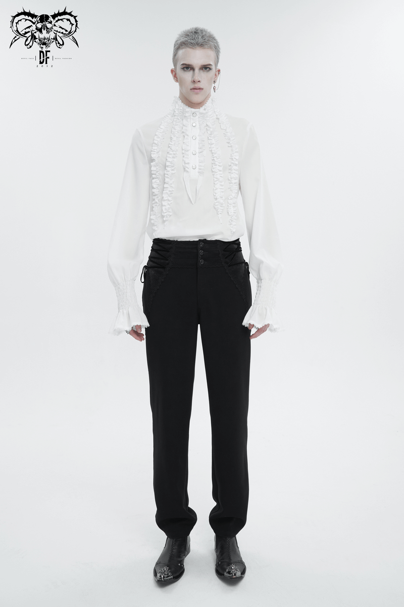 Men's vintage frilly white shirt with ruffled cuffs, stylish black pants, and fashionable boots for a daring look.