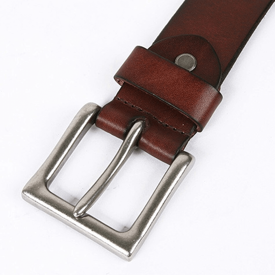 Close-up of a men's genuine leather belt with a silver pin buckle and rivets in stylish brown color.