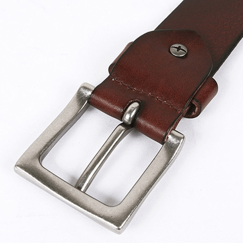 Close-up of punk-style brown leather belt with silver pin buckle and rivet detail, perfect accessory for alternative fashion.