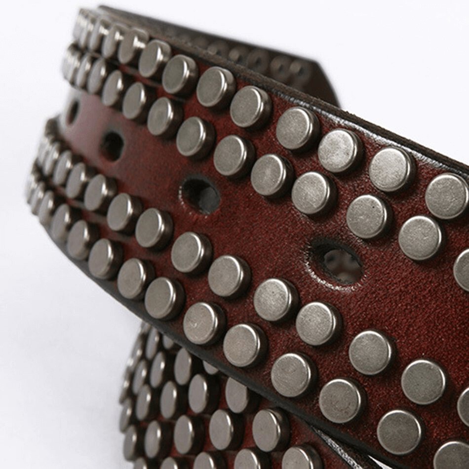 Close-up of a men's genuine leather belt with silver rivets, showcasing punk style and alternative fashion.