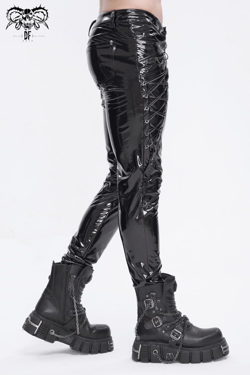 Men's glossy leather lace-up trousers with chains, styled with bold black platform boots for a daring look.