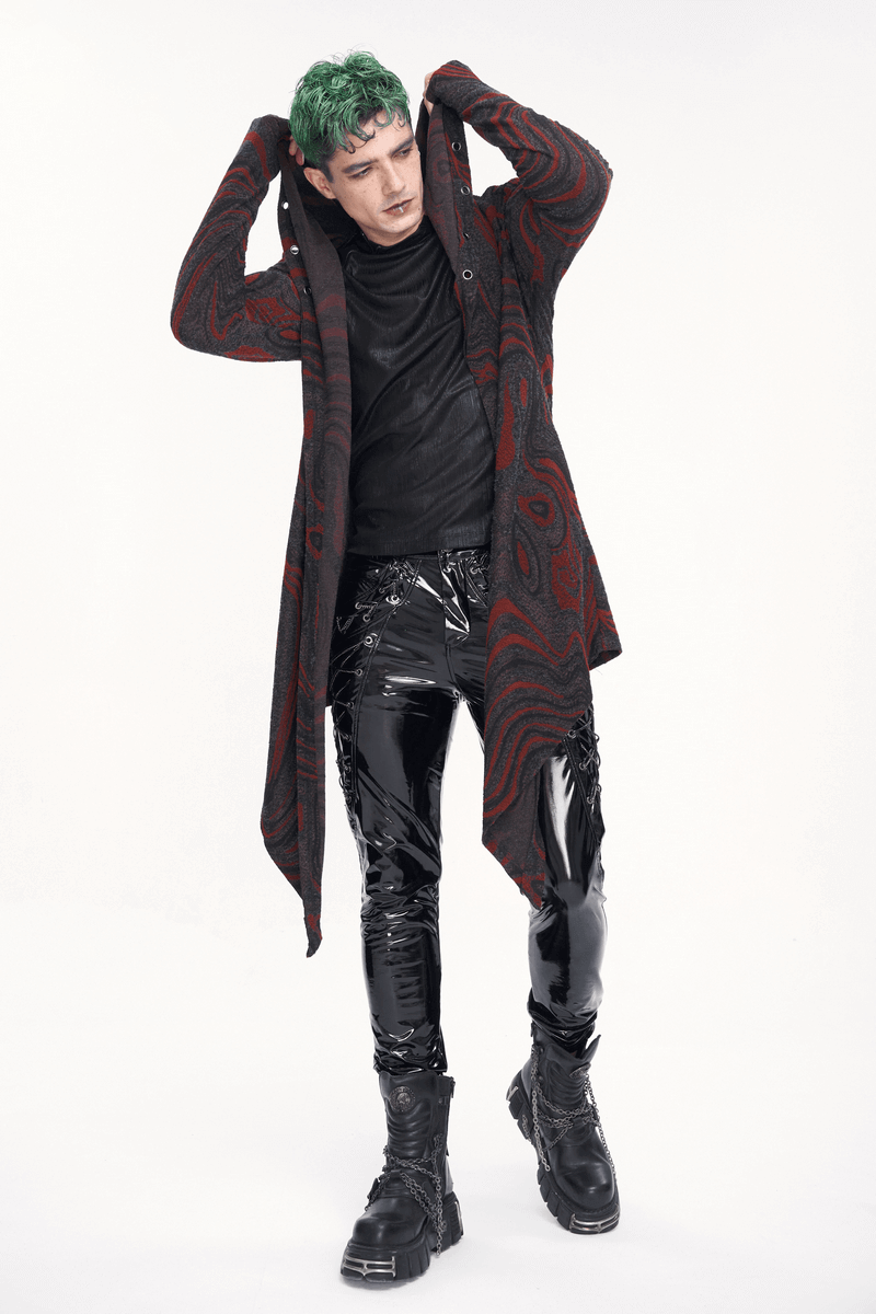 Men's goth irregular hooded coat with chains, styled with shiny black pants and bold green hair, exuding edgy fashion.