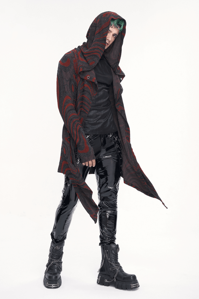 Men's goth irregular hooded coat in black and red with asymmetrical cut and chains, styled with glossy pants.