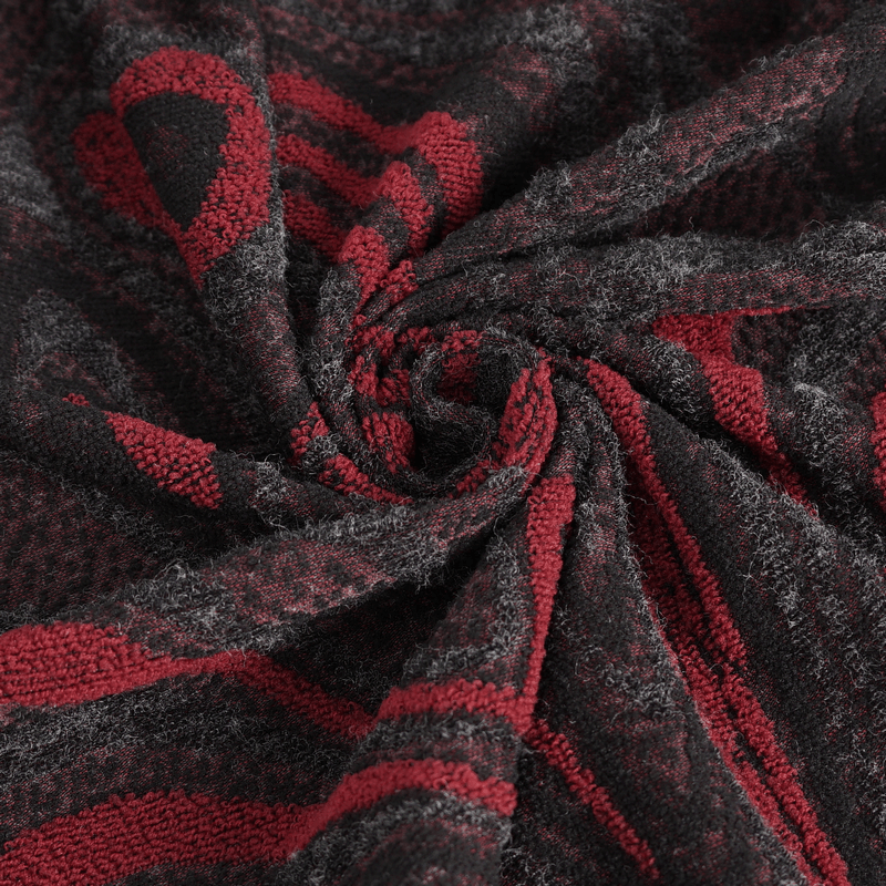 Close-up of soft black and red patterned fabric, perfect for a gothic coat design.