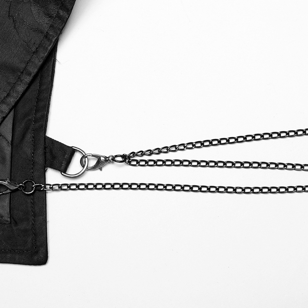 Close-up of black metal chain details on a gothic waistcoat with adjustable features and unique design elements.