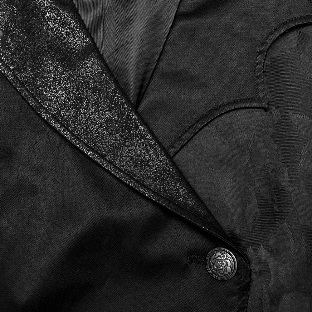 Detailed close-up of a dark asymmetric waistcoat with textured fabric and intricate metal buttons. Perfect for gothic style.