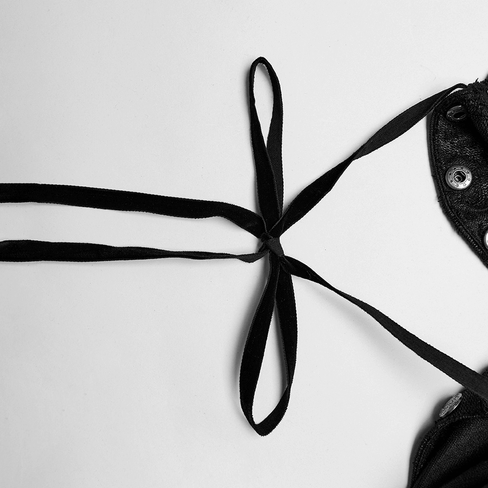 Detail shot of the black ribbon ties on a men's Gothic bat collar cape with lace detailing.