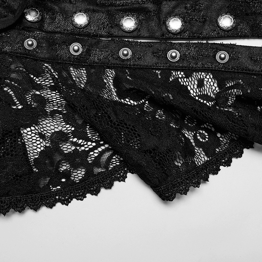 Close-up of black lace detail and Gothic snap buttons on a men's Victorian style detachable ruffle cape.