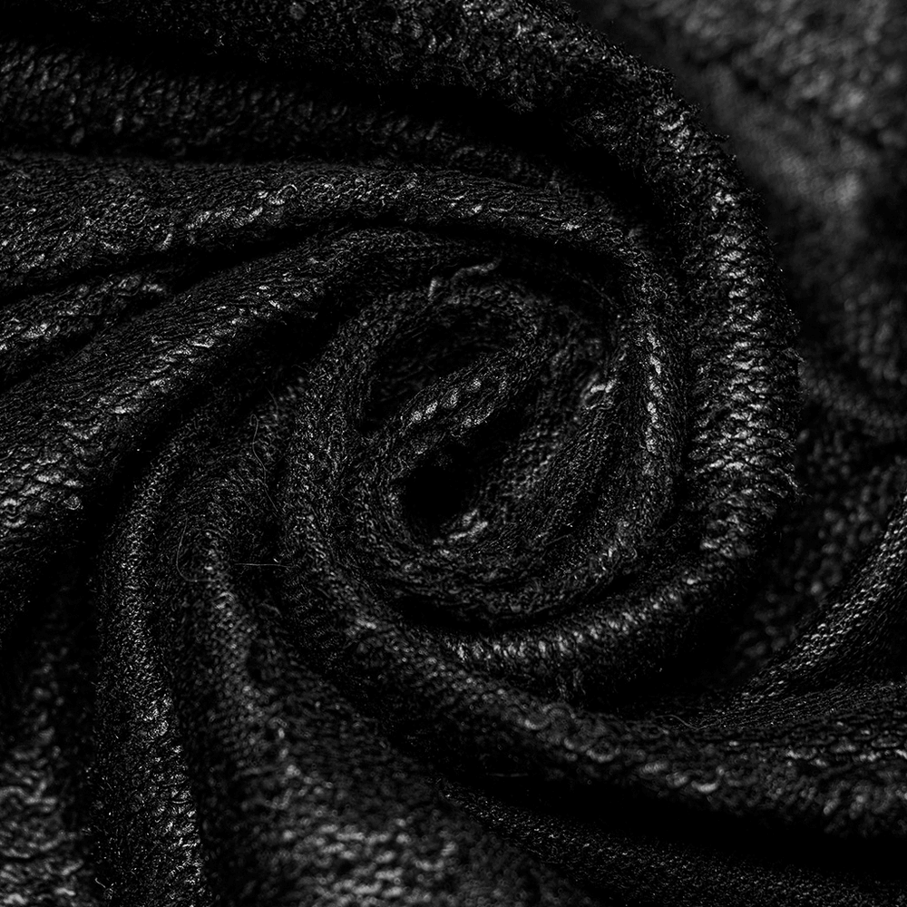 Close-up of luxurious black textured fabric, showcasing its intricate weave and rich depth for Gothic fashion.