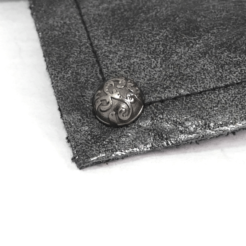 Close-up of a stylish gothic black elastic glove showcasing a decorative rivet detail.