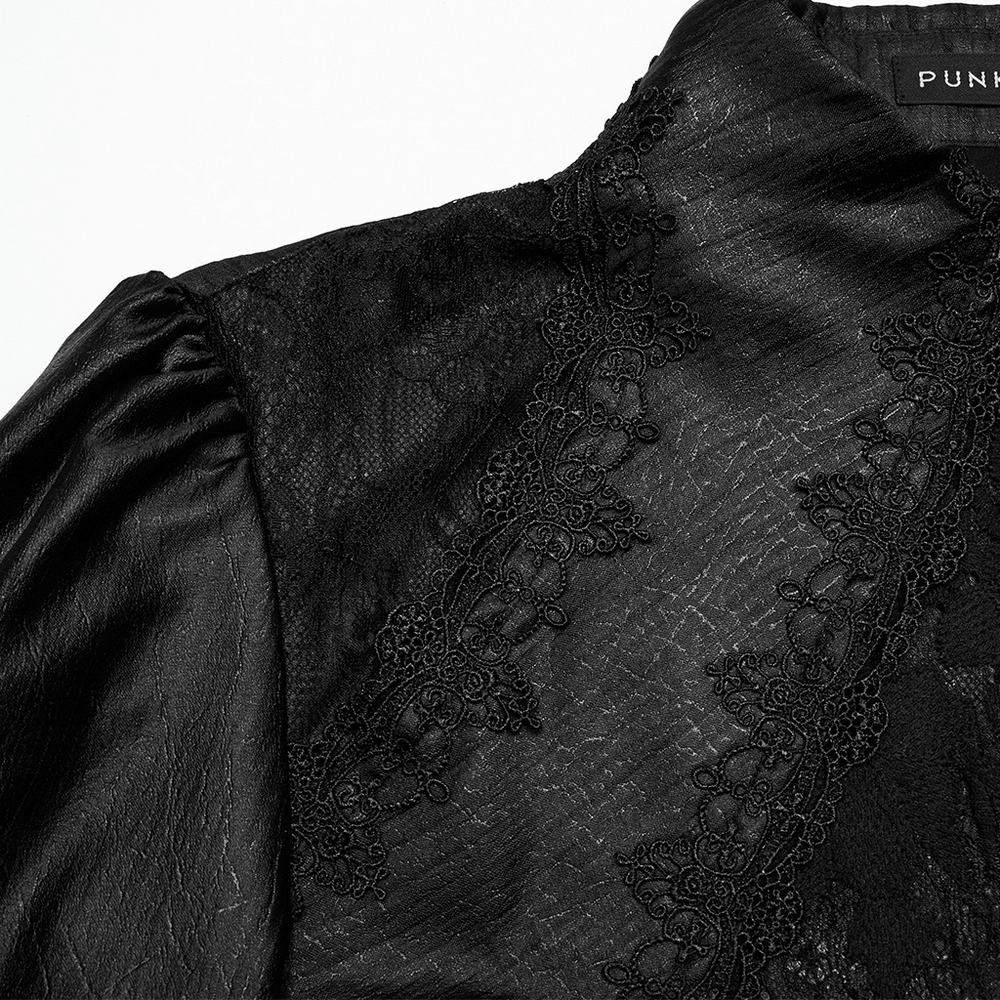 Close-up of men's gothic black lace shirt with bubble sleeves and intricate lace collar detailing.