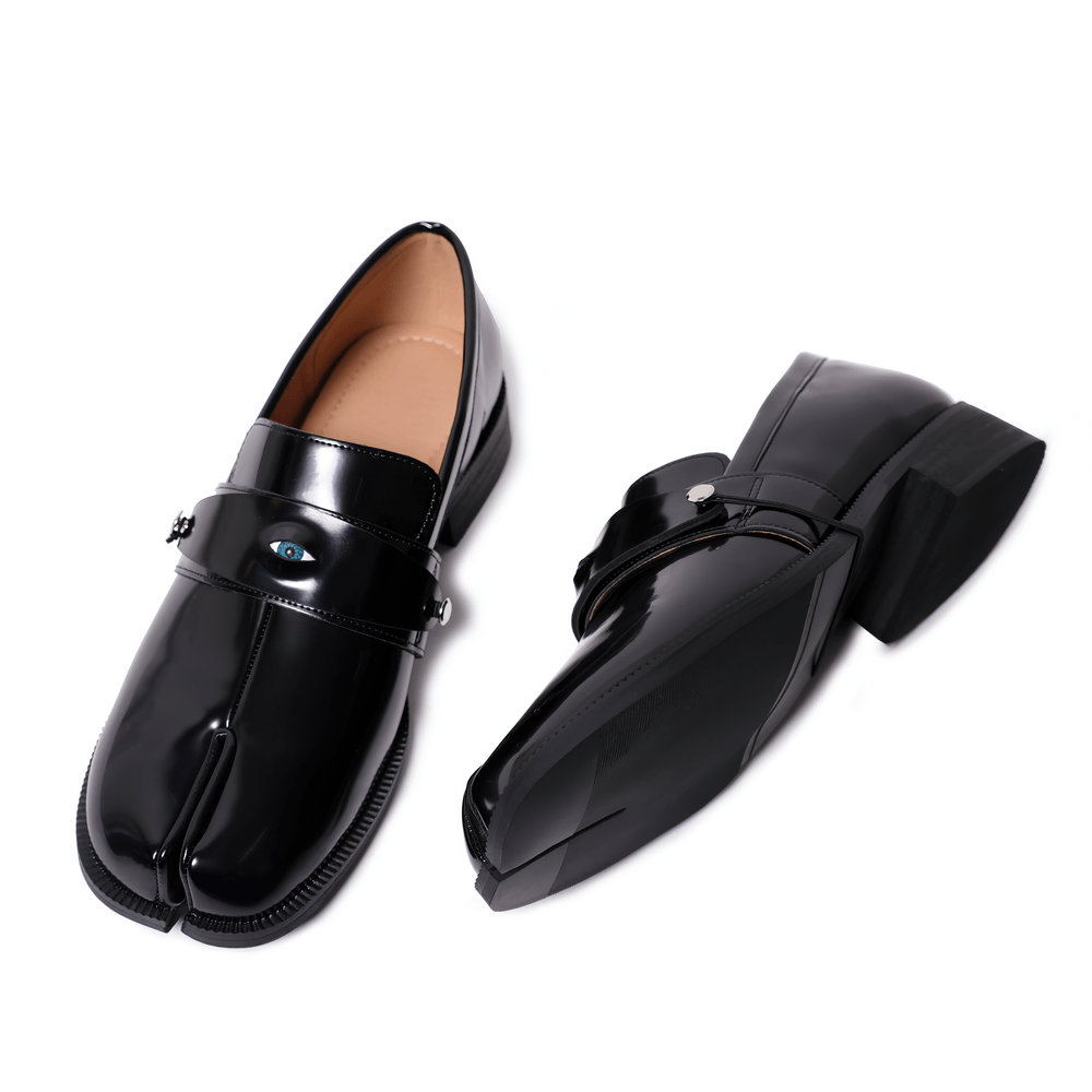 Mocassins gothiques noirs pour homme à bout fendu avec détail en forme d'œil