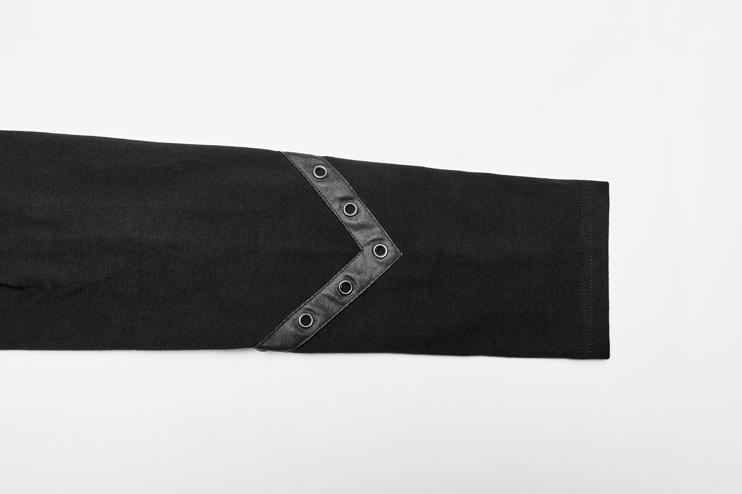 Black long sleeve shirt detail showcasing unique leather strap and metal grommet accents for punk streetwear style.