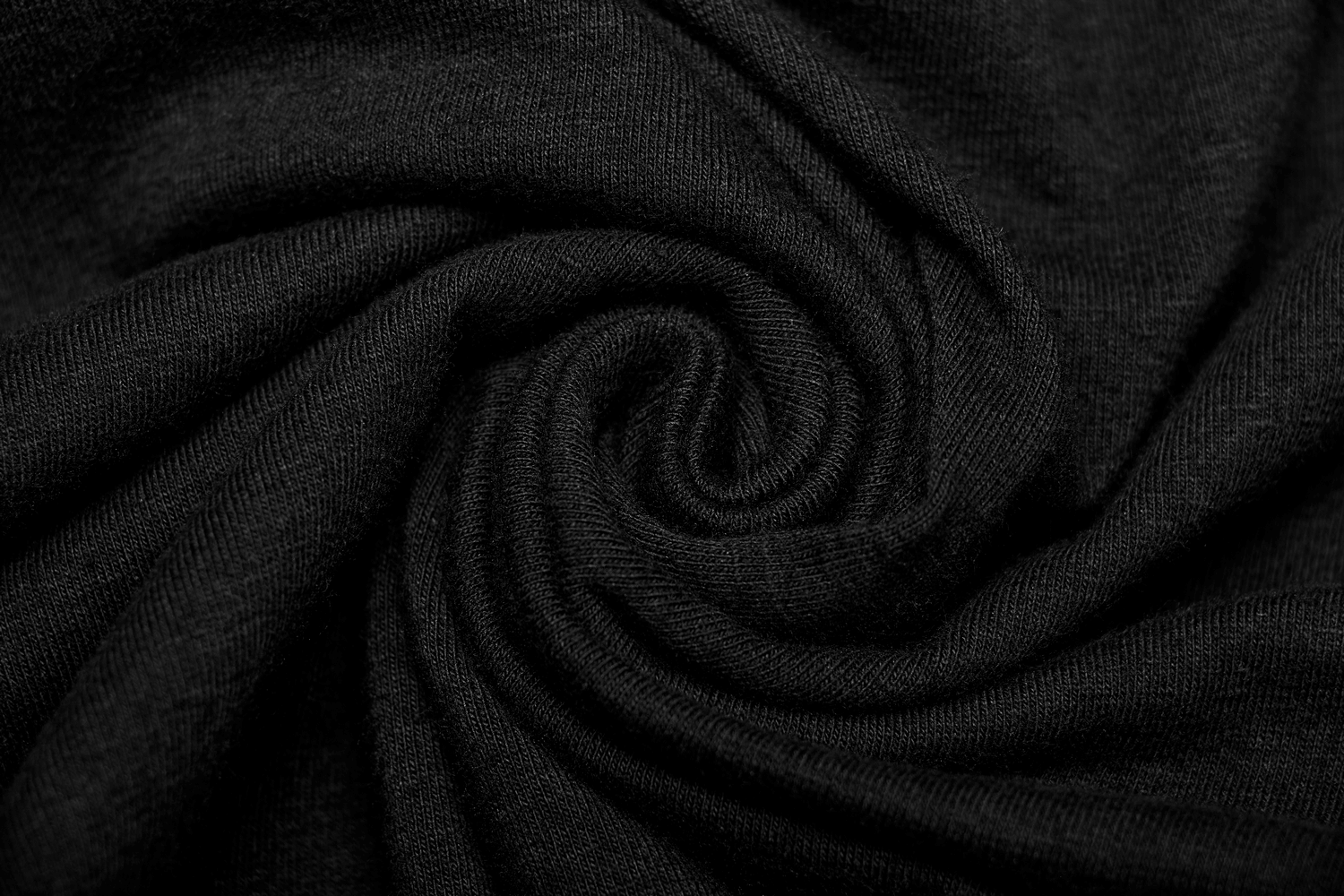 Close-up of soft black stretchy fabric, perfect for a Gothic punk long-sleeve top.